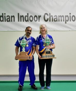 Bhartu and Charlton holding trophies